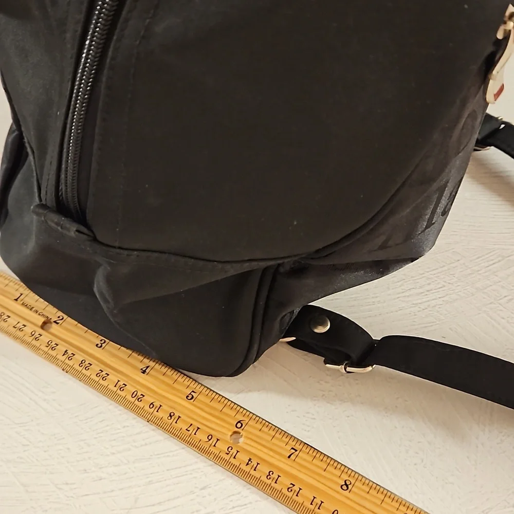 Black backpack convertible bag international city names on sections EUC